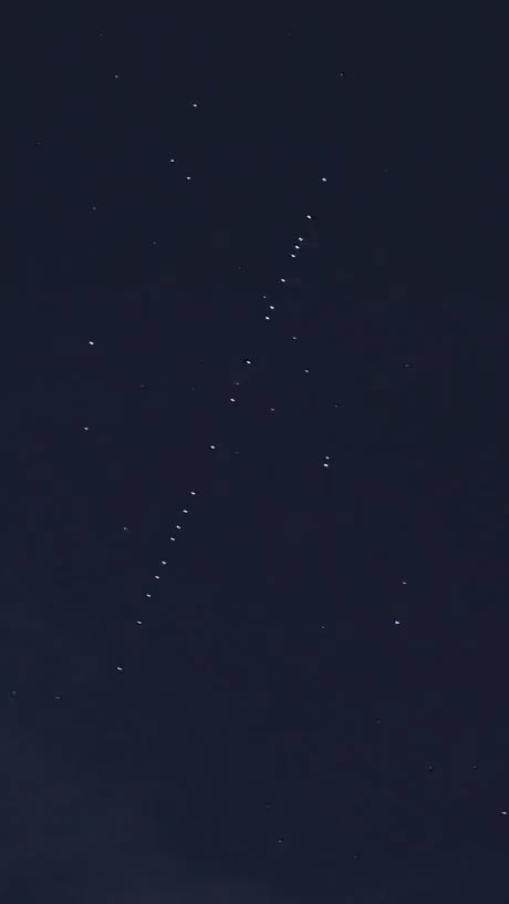 Starlink satellites moving throught the night sky