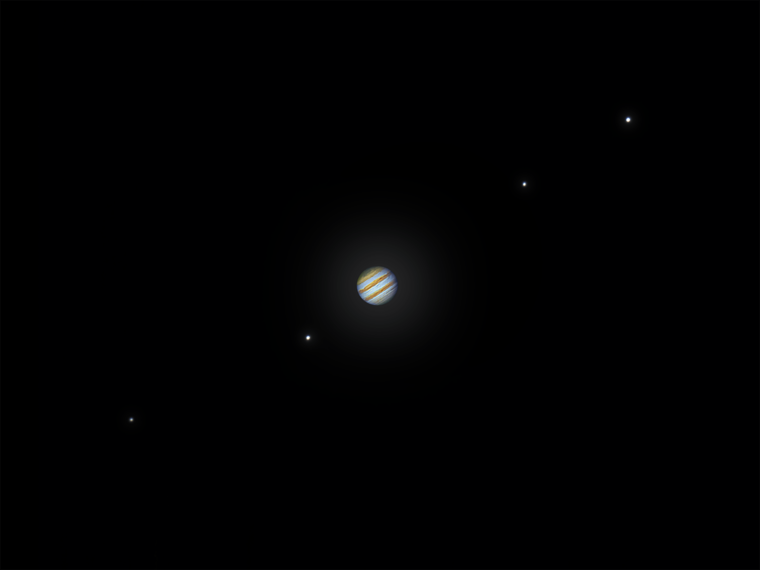 Jupiter and its 4 Galilean moons through my 8 inch Dobsonian telescope. Through the eyepiece they looked absolutely incredible