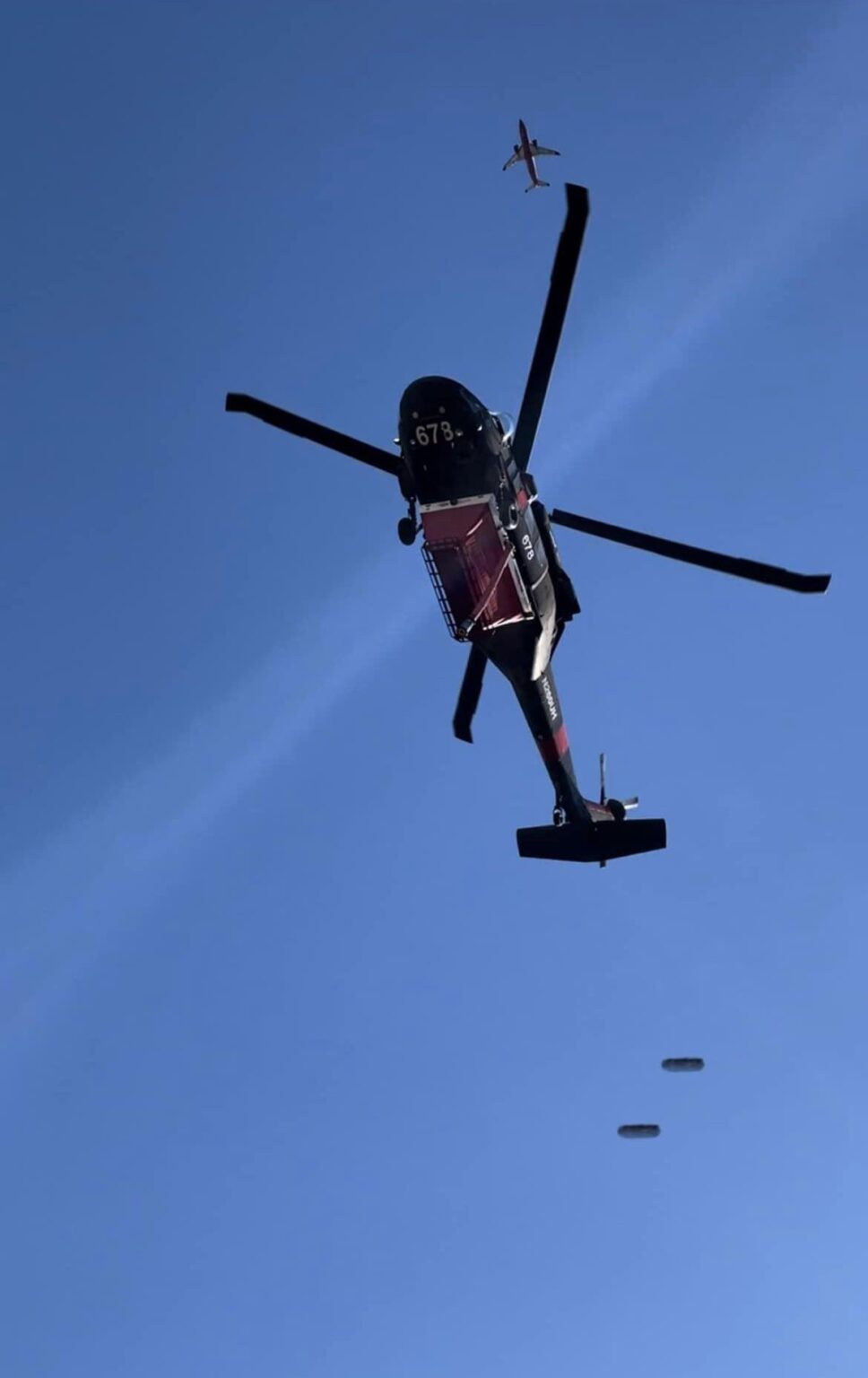 Photo of a fire fighting helicopter captured something strange.