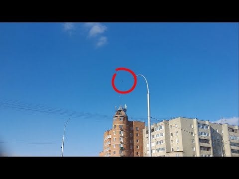 UAP sphere hovering over a building in moscow and only visible through a special (polarized?) type of glass