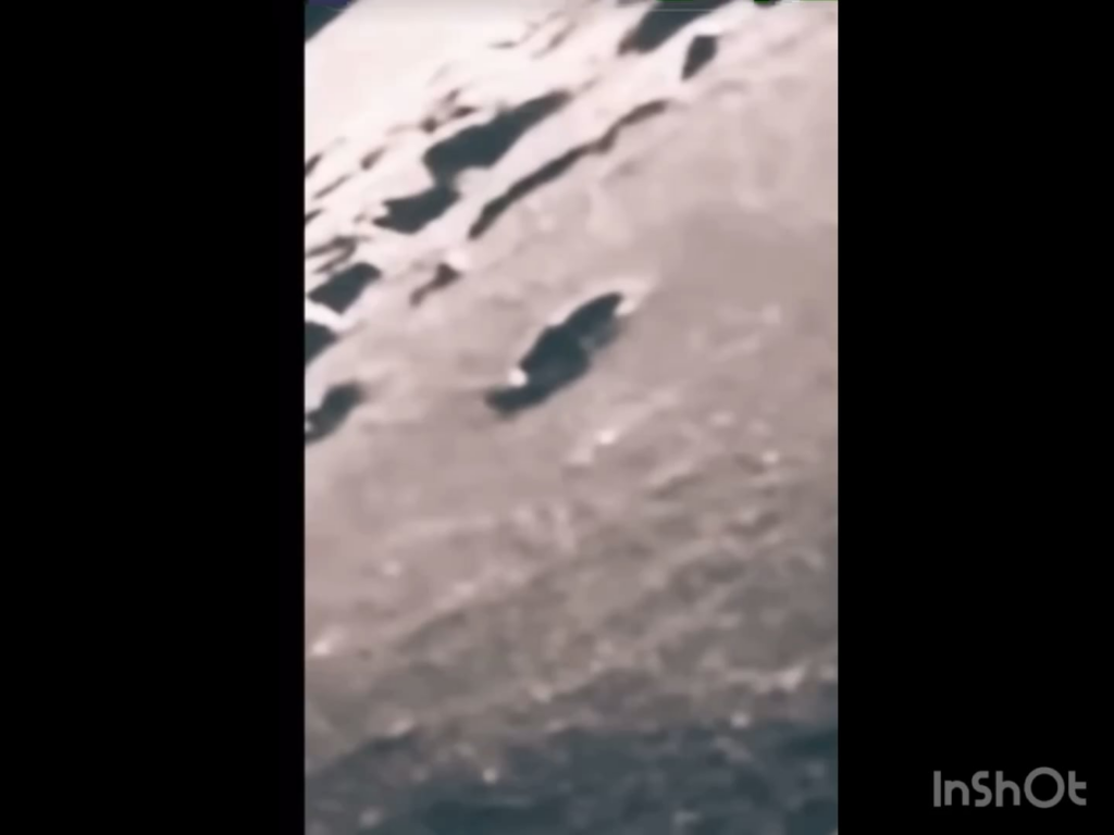 Alien craft leaving moon crater