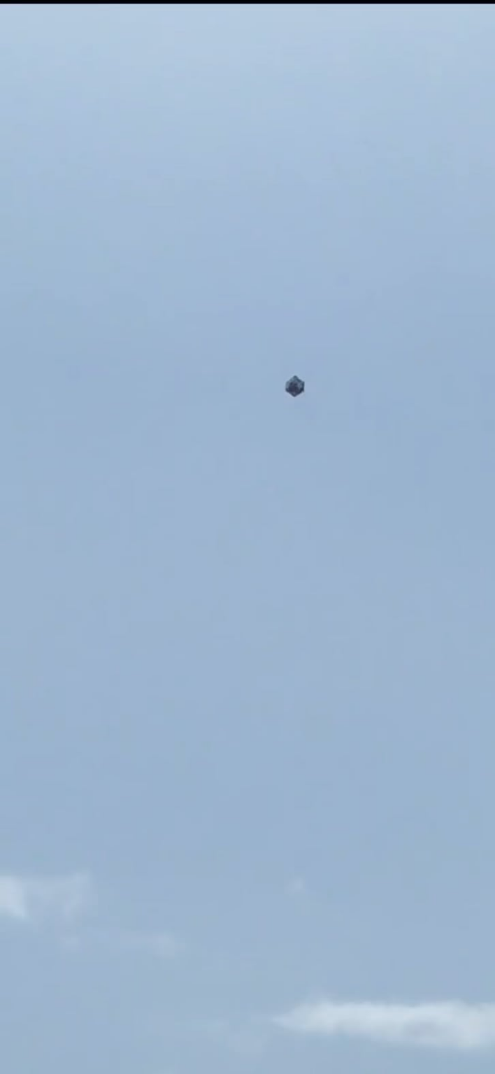 A SphereUFO slowly landing somewhere in Medellín Colombia
