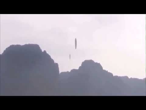 Cylinder shaped alien ships take off into the atmosphere
