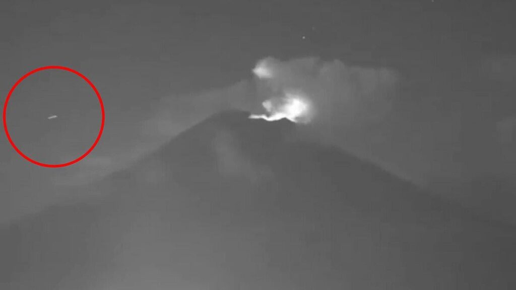 Multiple 'UFOs' caught on camera flying over erupting volcano claimed to be a 'wormhole' for aliens