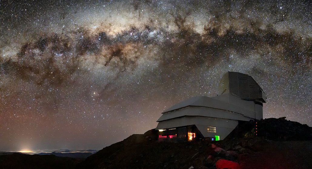a photo of the Vera Rubin Telescope under a very starry night sky