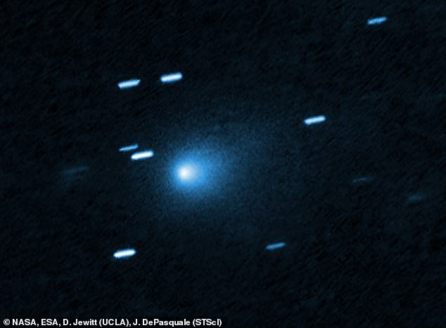 NASA will reveal the real identity of the mysterious interstellar object 3I/ATLAS in a press conference tomorrow after remaining silent for over a month. Pictured: 3I/ATLAS seen by the Hubble Space Telescope on July 21