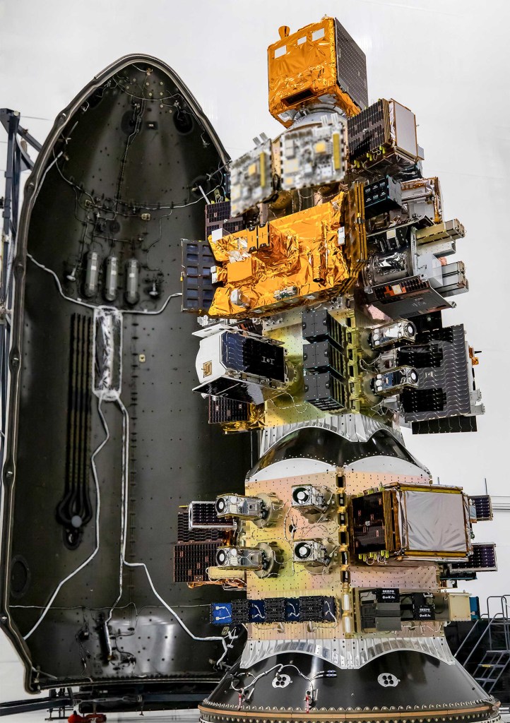 The Transporter-15 payloads stacked in place before begin tucked into the Falcon 9 rocket's payload fairing or nose cone.