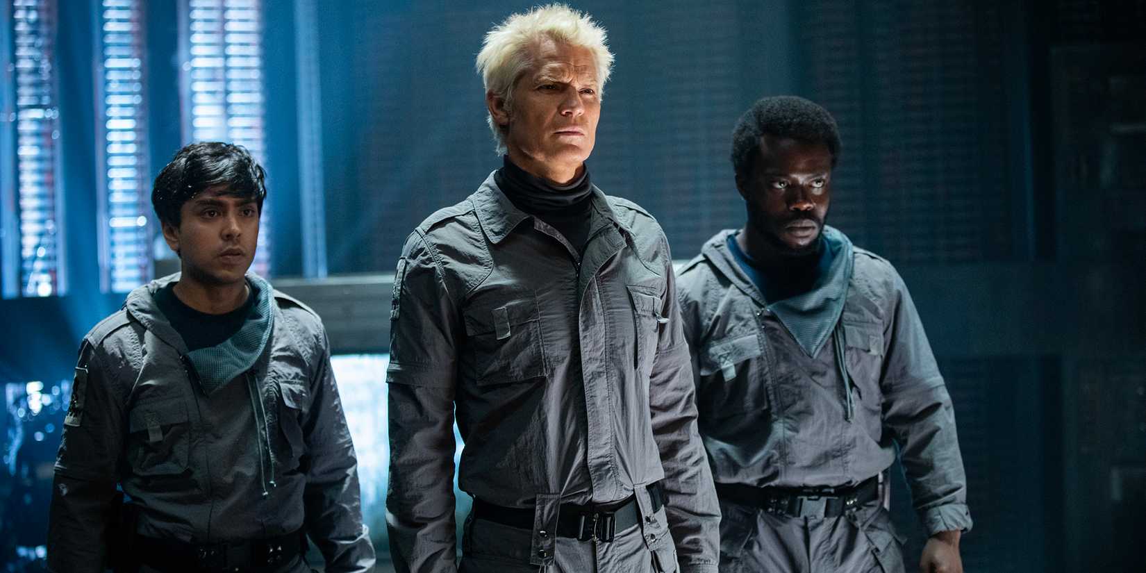 Timothy Olyphant's Kirsh looking confused while Adarsh Gourav's Slightly and Jonathan Ajayi's Smee stand behind him in Alien: Earth