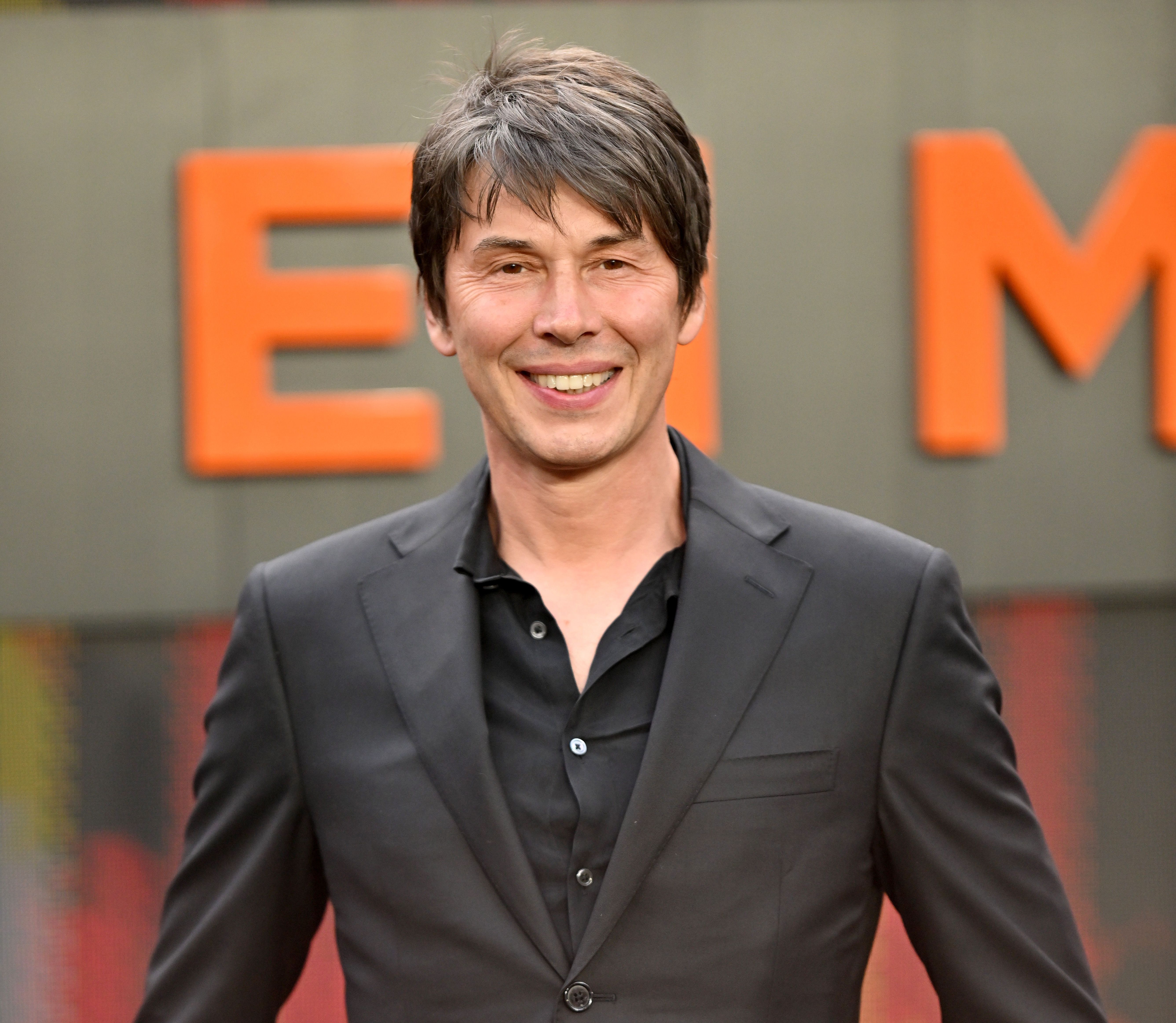 Professor Brian Cox smiling at the Oppenheimer UK Premiere.