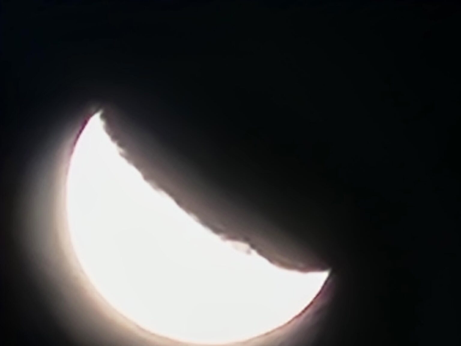 Tonight's Moon rotated 90 degrees looks like it's been ripped in half