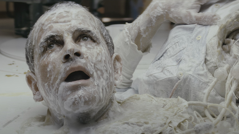 The head of Ian Holm as Ash lays on the floor covered in synthetic blood in Alien