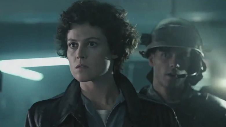 Riple and Hicks look concerned in Aliens