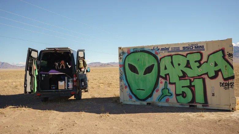 A van photographed next to Area 51 alien graffiti