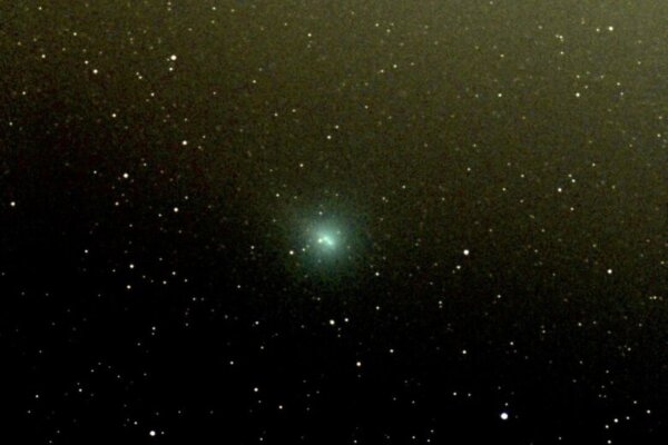a picture of a comet among stars