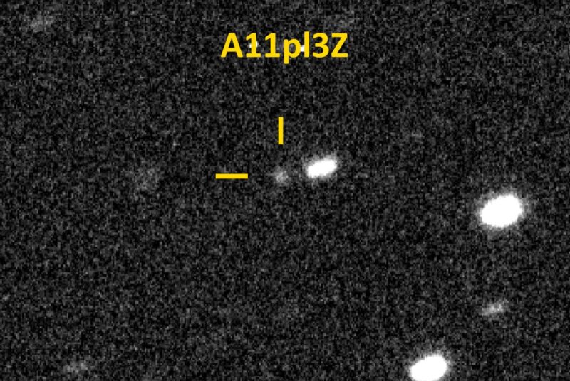 Interstellar object: Black background with some white oblong shapes and a dim white round shape at center with the label A11pI3Z.