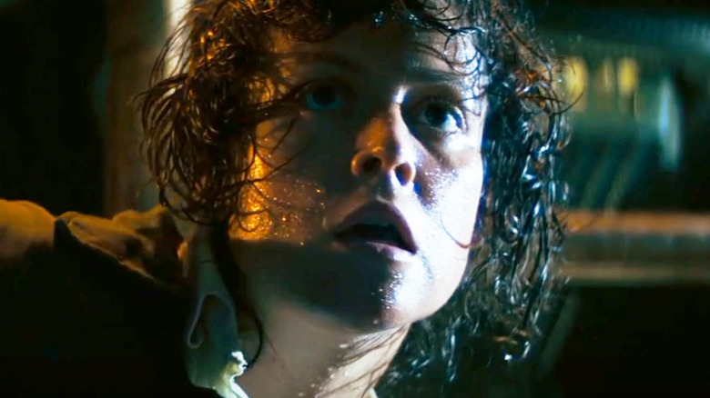 Sigourney Weaver as Ellen Ripley looks scared in closeup in Alien
