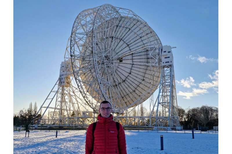 Bielefeld scientist Lukas Böhme, lead author of the study, in front of the Lovell Telescope at the Jodrell Bank Radio Observatory in England. Credit: Universität Bielefeld Our solar system is moving faster than expected