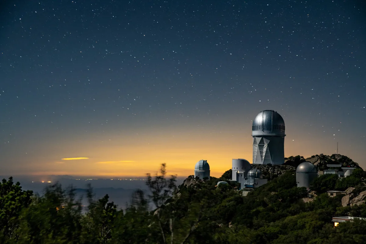 The Mayall 4-Meter Telescope, which will be home to the Dark Energy Spectroscopic Instrument (DESI), seen at night at Kitt Peak National Observatory.