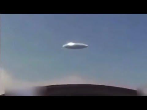 Cockpit footage of fighter jets pursuing a saucer shaped alien craft