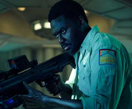 Morrow from Alien: Earth holds a gun.