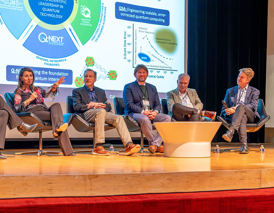 Directors of the five DOE National Quantum Information Science Research Centers participate in a panel discussion in Ramsey Auditorium at Fermilab on Thursday, Dec. 4. Left to right are: Anna Grassellino of the Superconducting Quantum Materials and Systems Center, Martin Holt of the Q-NEXT Center, Travis Humble of the Quantum Science Center, Bert De Jong of the Quantum Systems Accelerator Center, and Charles Black of the Co-design for Quantum Advantage Center.
