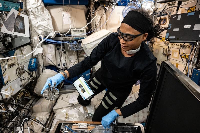 NASA astronaut Jeanette Epps configures the Metal 3D Printer to produce experimental samples from stainless steel. NASA