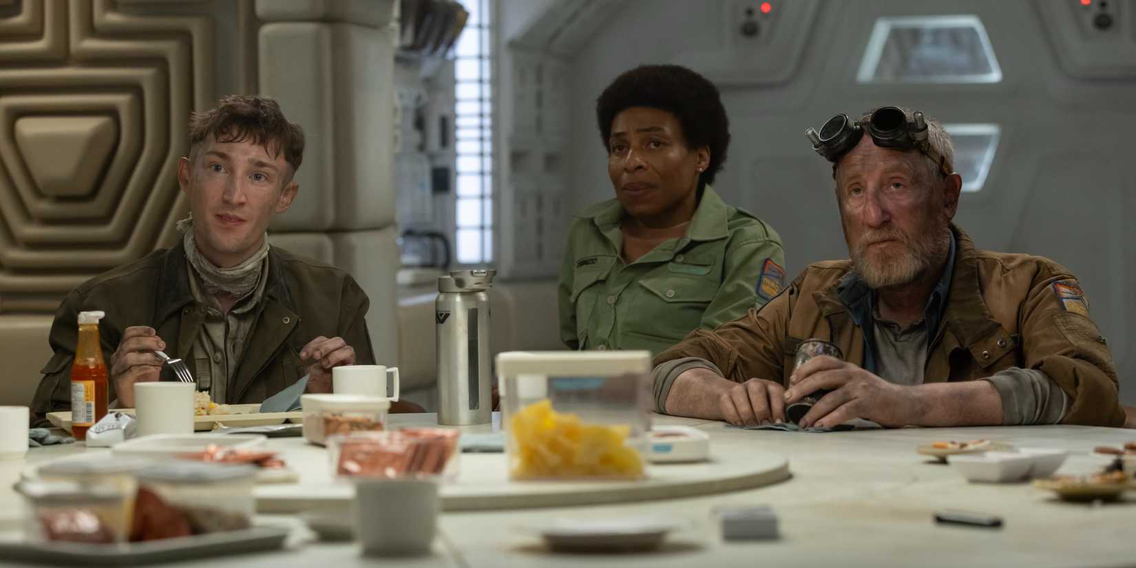 The Maginot crew sitting at a table having a meeting in Alien: Earth episode 5