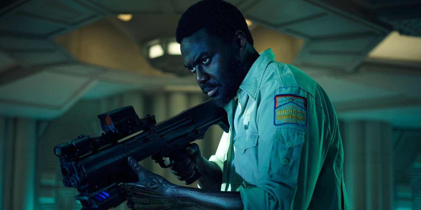 Morrow from Alien: Earth holds a gun.