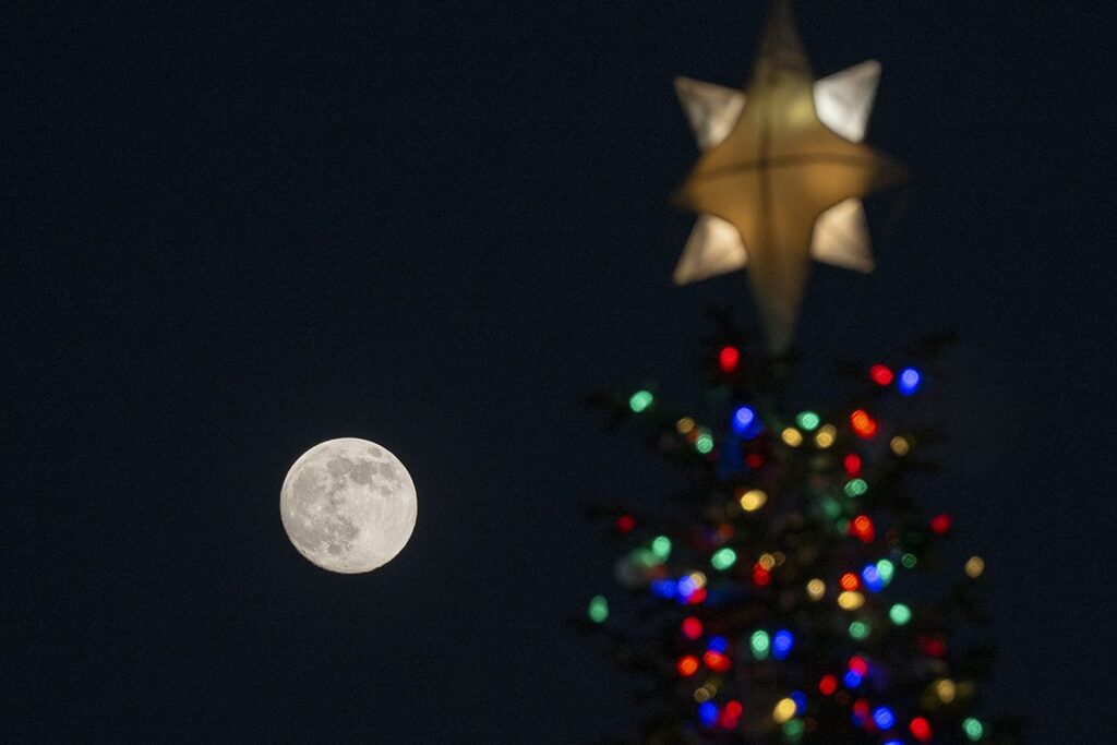The December Cold Moon rises above the US Capitol Christmas Tree in Washington DC, United States on 3 December 2025. Photo by Celal Gunes/Anadolu via Getty Images