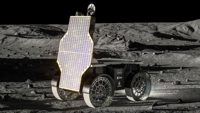 Lunar rover with extended solar panels positioned on cratered Moon surface
