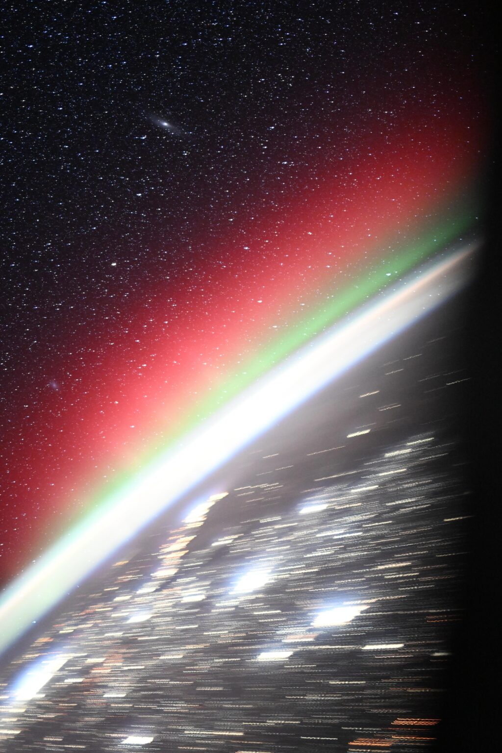 Festive auroras with Andromeda star field, as seen from the ISS