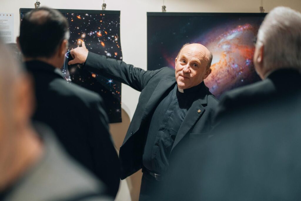 Wonder and discovery coalesce at Vatican Observatory exhibition A man points to an image of the stars