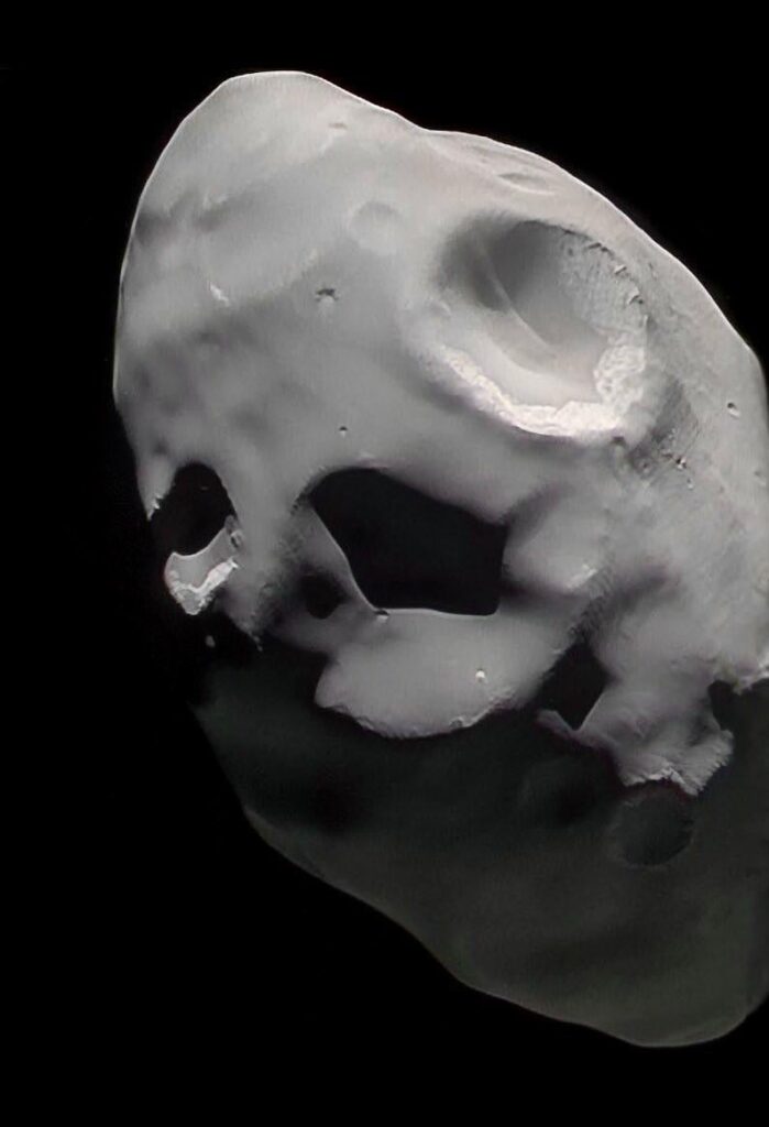 Saturn's 84-km-wide moon Pandora, imaged with Cassini 9 years ago today, December 18, 2016 in IR, green, and UV wavelengths from a distance of about 35,400 km.