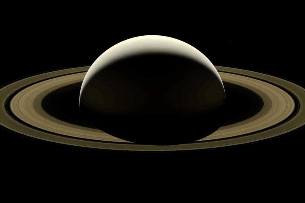 Saturn's rings form a giant dusty doughnut encircling the planet