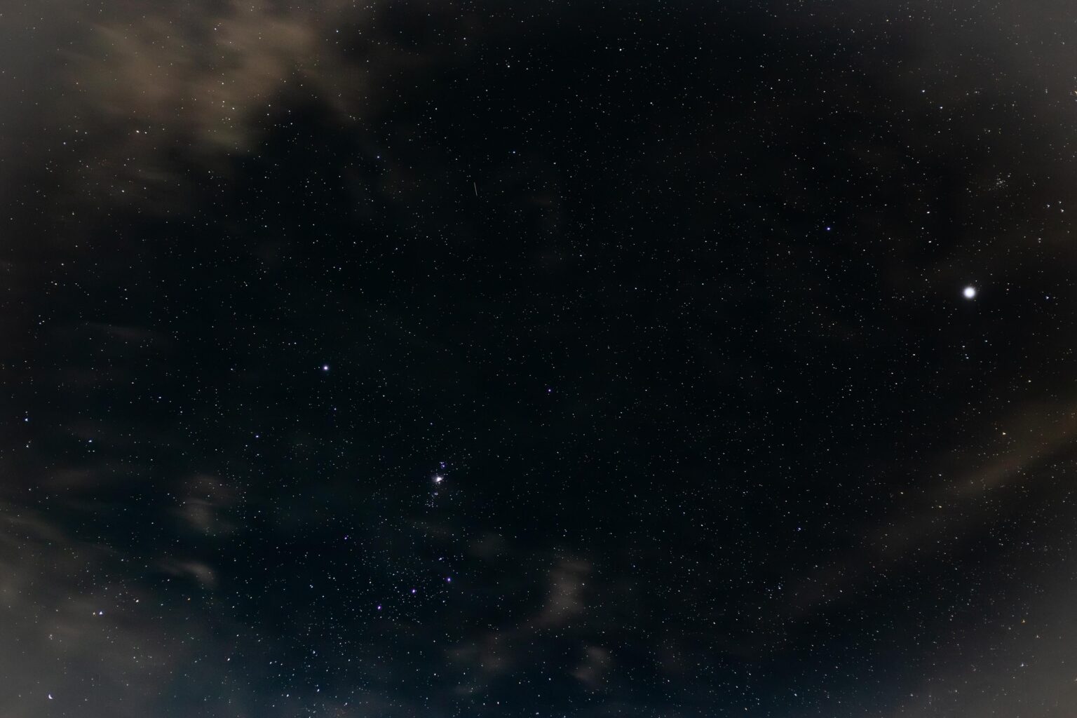 From my backyard in Rouse Hill, Australia, Jupiter sits to the right, while to the left is half of the upside-down Orion the Hunter, showing the Hunter’s Belt and Orion Nebula positioned to its north. The Hunter's head is partially blocked by my next-door neighbour’s rooftop, so I cropped it out.