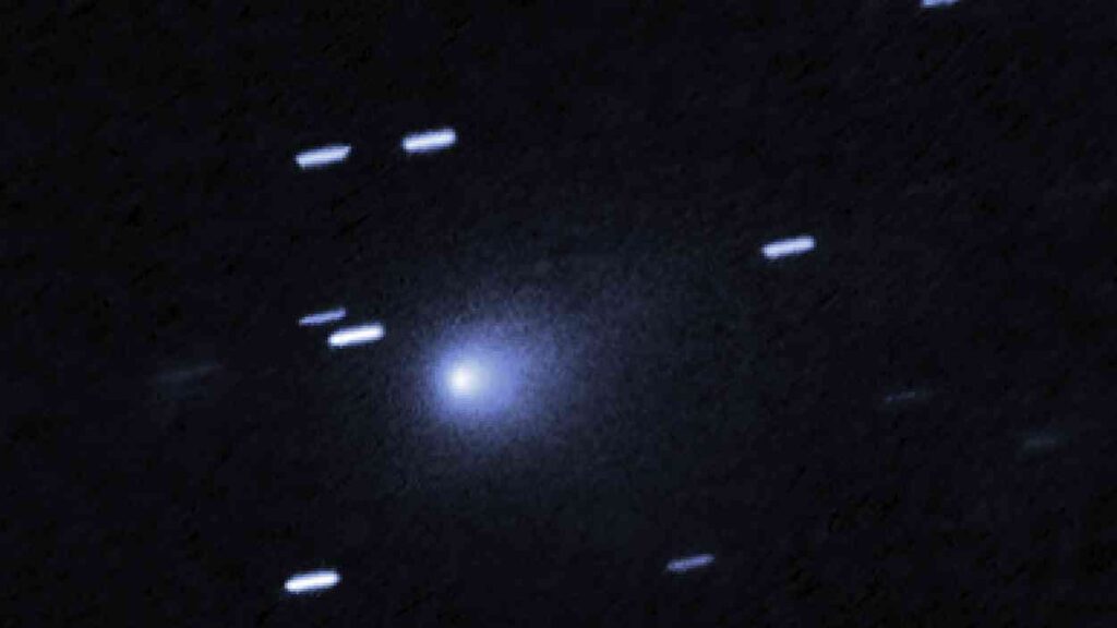 Comet 3I/ATLAS visible as a bright nucleus with a fuzzy coma against a field of stars – an interstellar object passing through the Solar System.