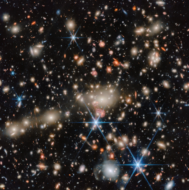 Webb’s Picture of the Month A myriad of tiny distant galaxies, with a group of very many small foreground galaxies.