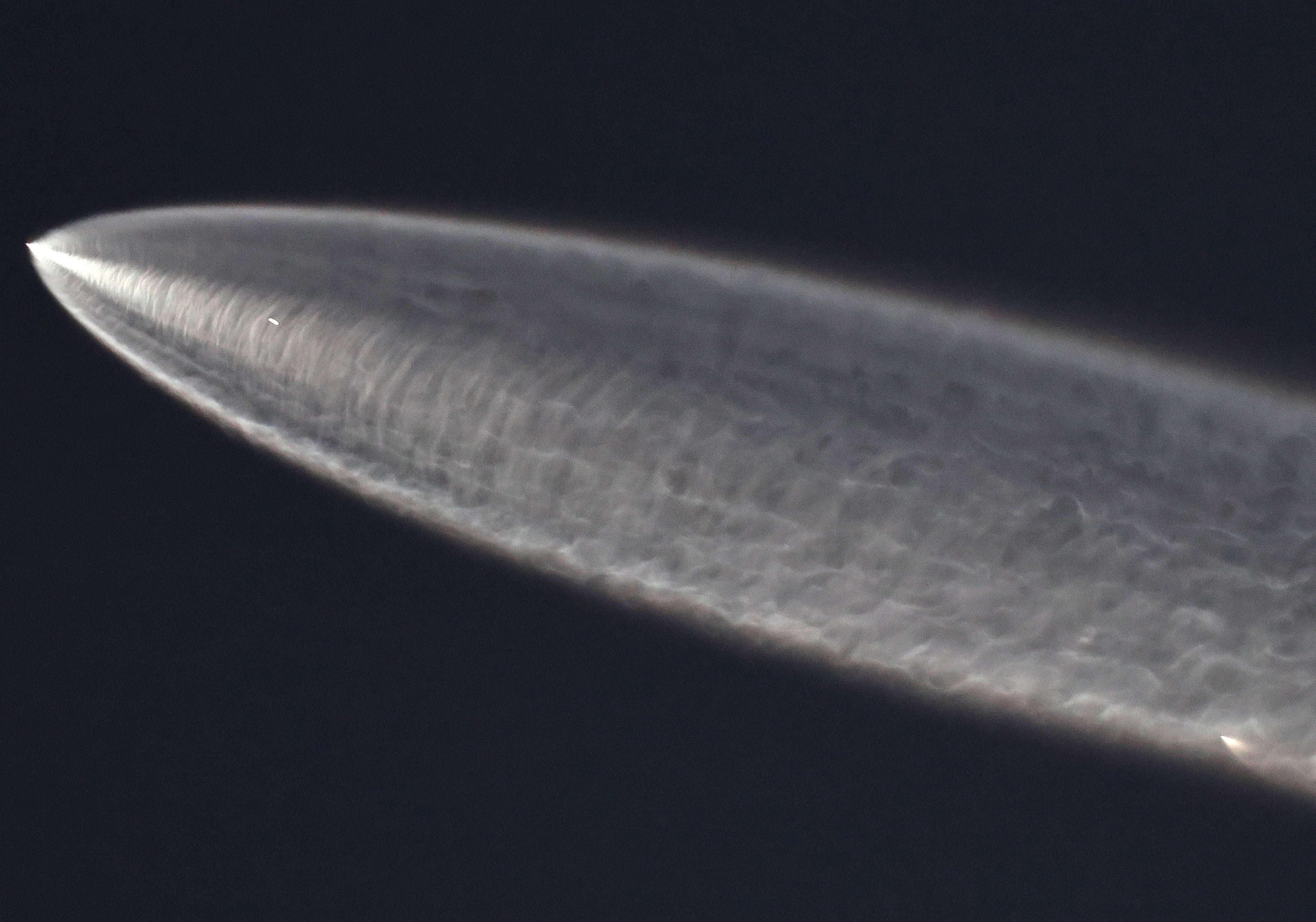 A SpaceX Falcon 9 rocket rises after launching from Vandenberg Space Force Base carrying 28 Starlink internet satellites
