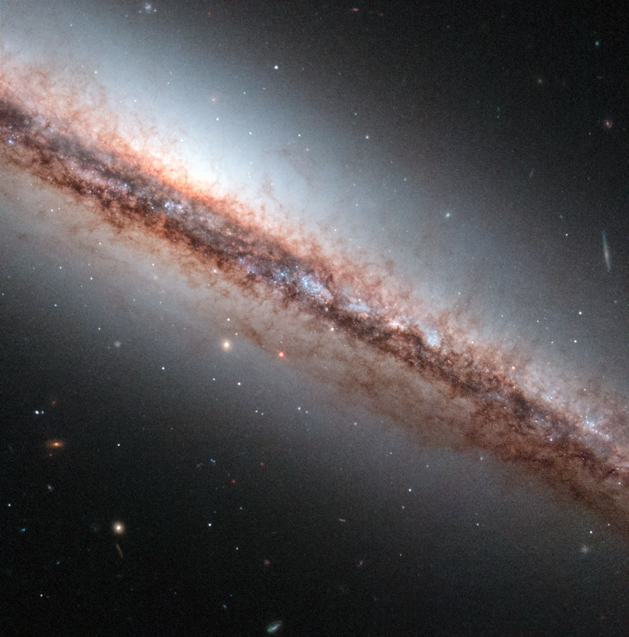 This NASA/ESA Hubble Space Telescope image shows spiral galaxy NGC 4217, which lies 60 million light-years away from us.