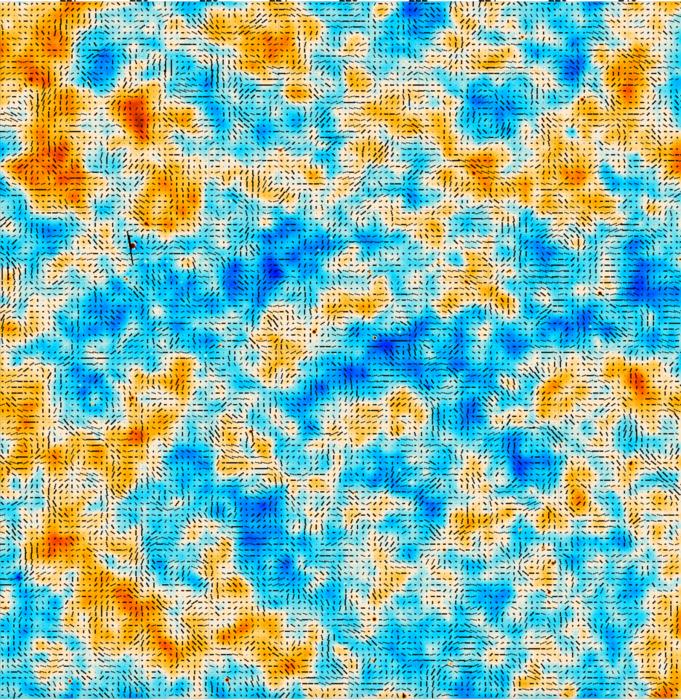 Image of a intensity map showing seemingly random splotches of light to dark orange and light to dark blue depending on microwave intensity.