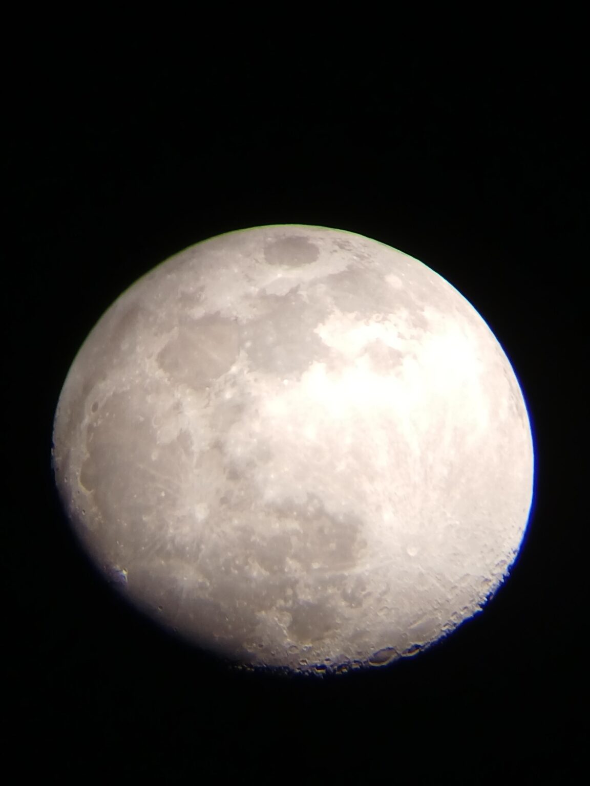 I got my first telescope for Christmas and used it to take this photo of the moon last night! :)