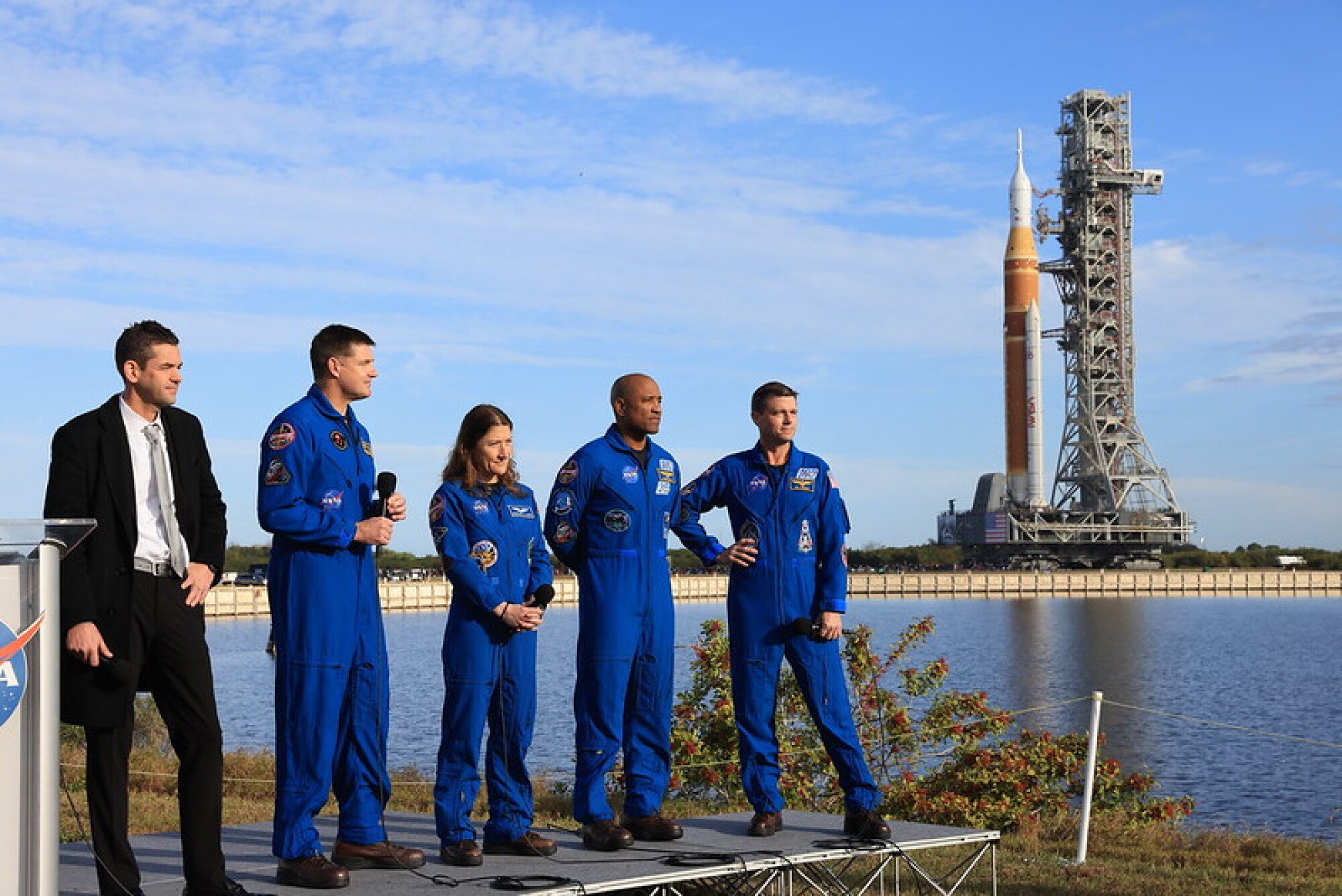 NASA administrator and Artemis 2 crew talking to reporters as SLS rocket rolls behind them on Jan. 17, 2026