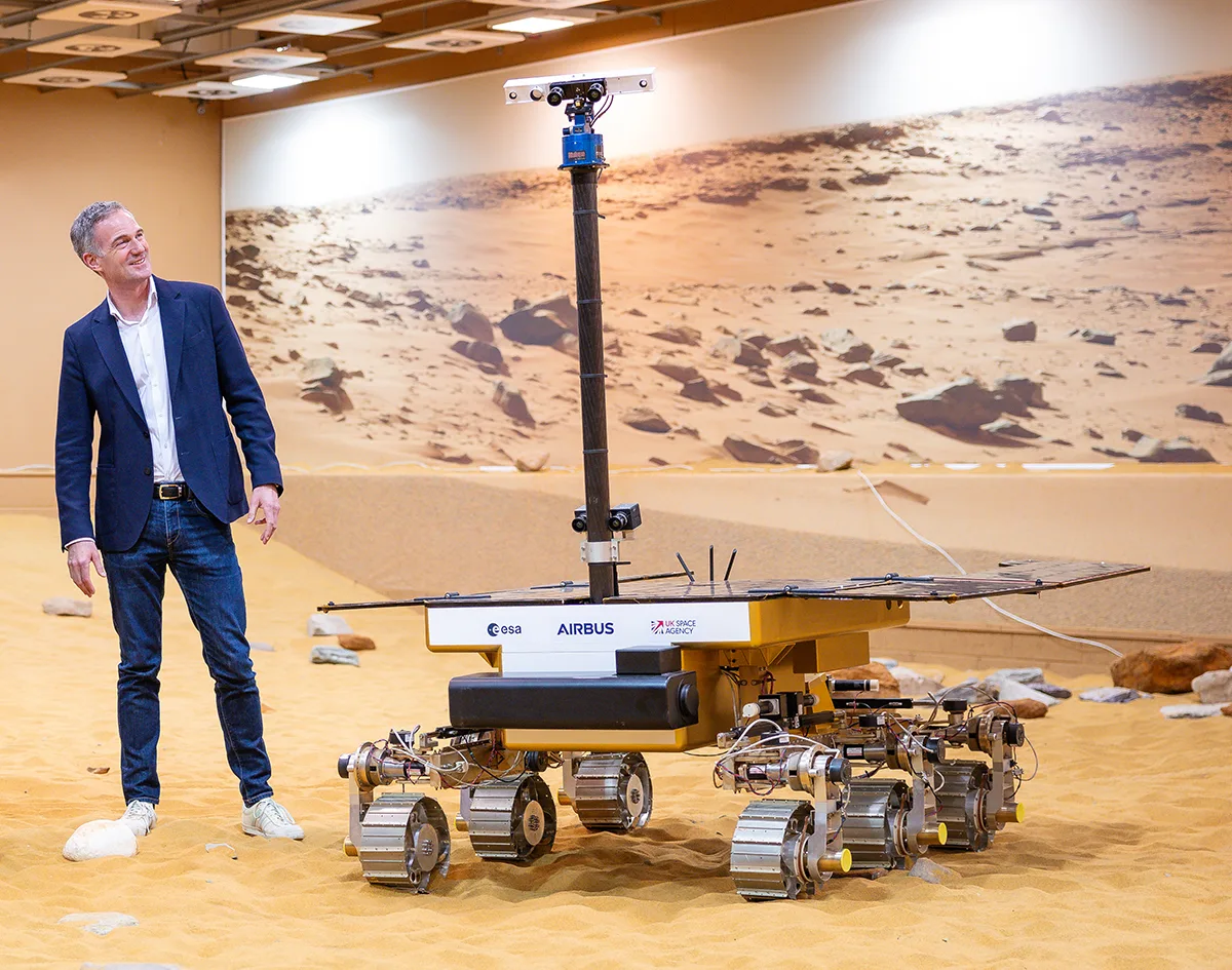 Former UK Technology Secretary Peter Kyle next to a mockup of the ExoMars Rosalind Franklin rover on display at Airbus's facility in Stevenage, UK, March 2025. Credit: ESA/DSIT