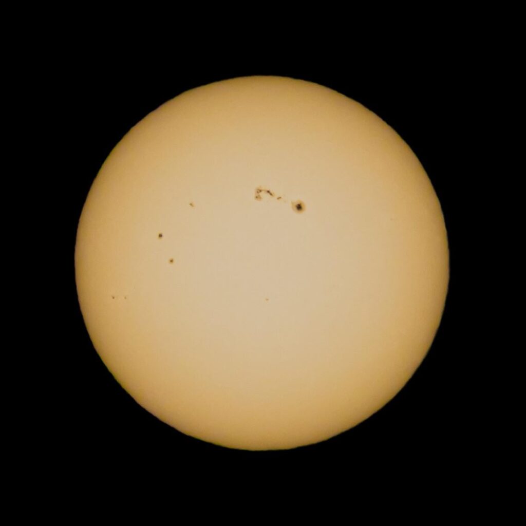 Attempt of photographing the large sunspot on a Telephoto lens.