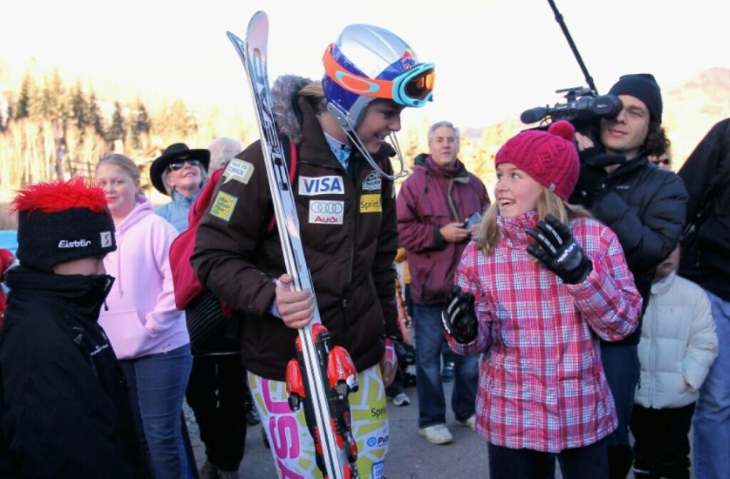 Lindsey Vonn talks with a young fan as the US ski team trains in Vail in 2010