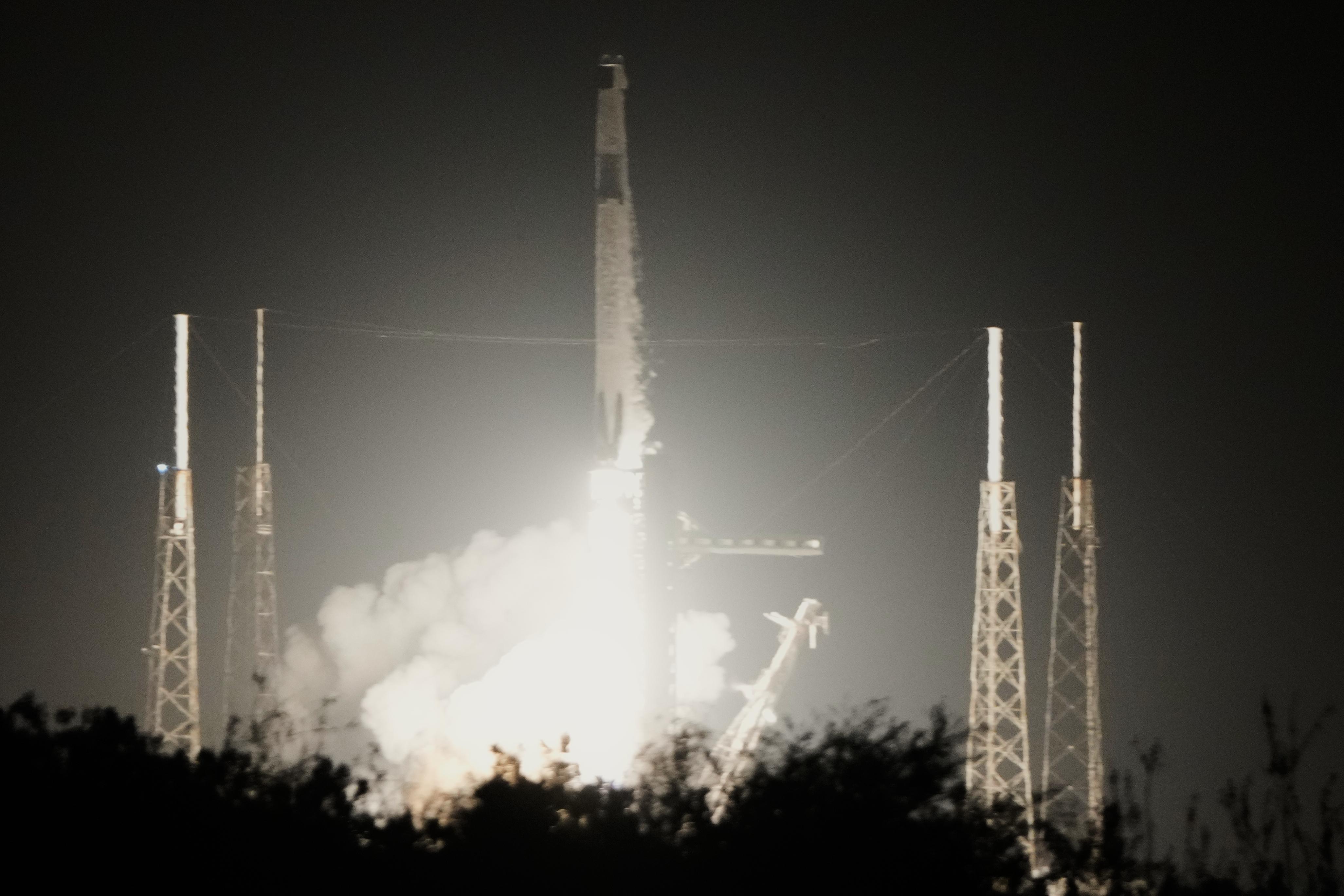 A SpaceX Falcon 9 rocket with a crew of four...
