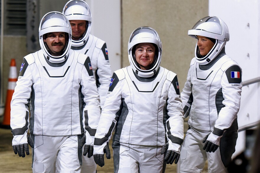 Crew-12 mission astronauts walk out of the Neil A. Armstrong Operations and Checkout Building before heading to pad 40 for launch to the International Space Station (ISS) aboard a SpaceX Falcon 9 rocket and Crew Dragon spacecraft at the Kennedy Space Center on February 13, 2026 in Cape Canaveral, Florida. (L-R) NASA astronaut Jack Hathaway, Roscosmos cosmonaut Andrey Fedyaev, NASA astronaut Jessica Meir and European Space Agency (ESA) astronaut Sophie Adenot will live and conduct research, technology demonstrations, and maintenance experiments aboard the orbiting laboratory for eight months.