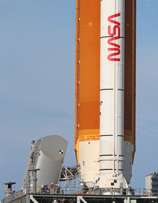 Engineers work on the Tail Service Mast Umbilical of the Artemis I rocket as it sits on Launch Pad 39B at NASA's Kennedy Space Center on November 13, 2022.