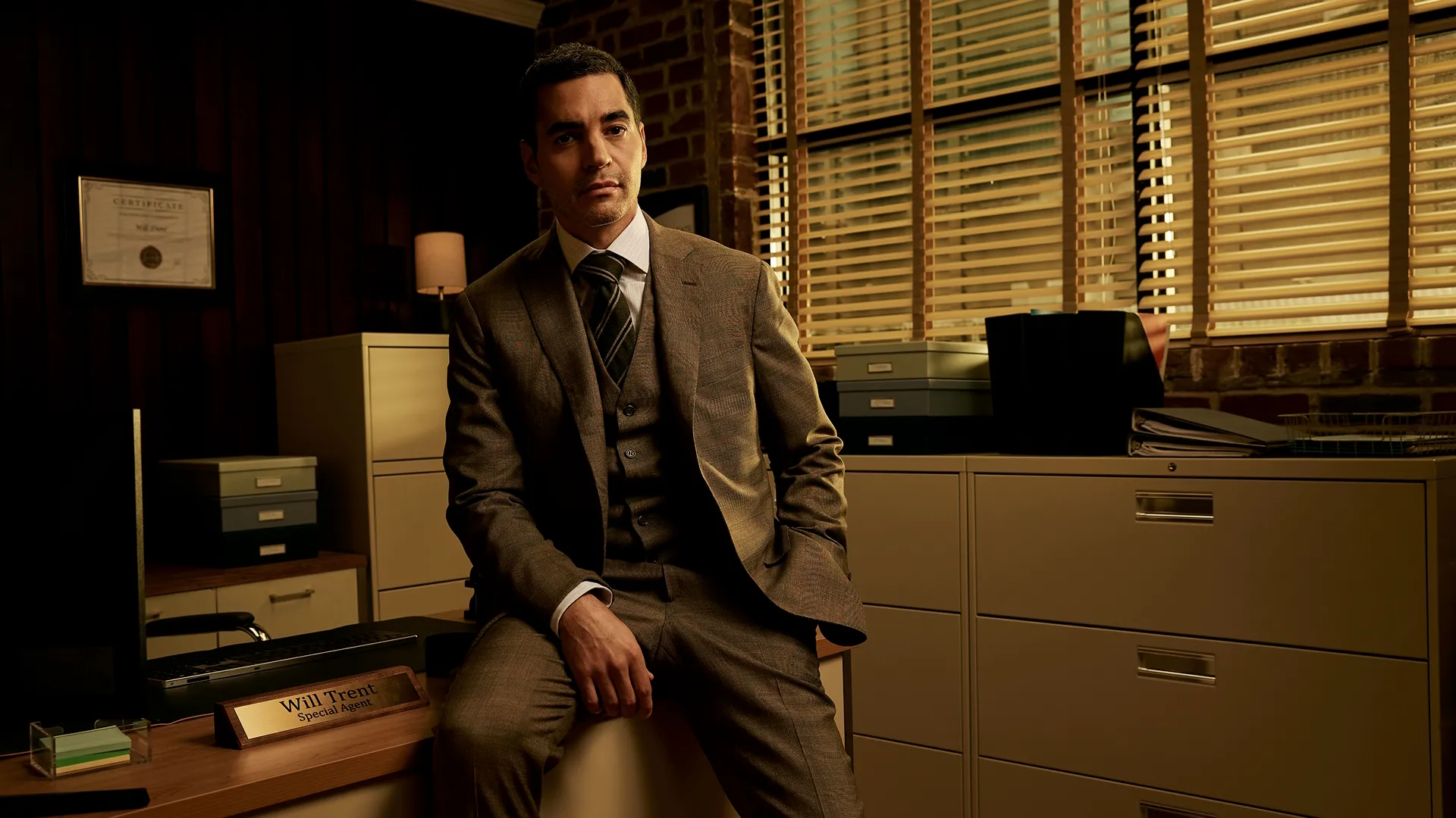 Will Trent (Ramon Rodriguez) sitting in an office