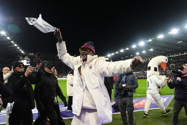 Swansea co-owner Snoop Dogg waves his towel 